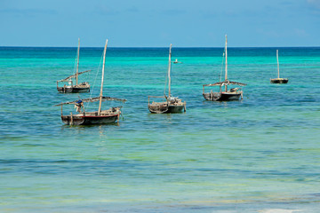 Sticker - Wooden sailboats (dhows) on the clear turquoise water of Zanzibar island