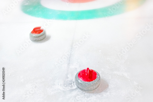 Fotografia white winter sport curling game outdoor activity granite red stones on natural i