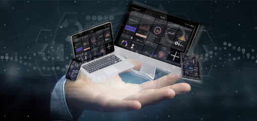 Poster - Businessman holding Devices connected to a cloud multimedia network 3d rendering