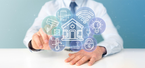 Poster - Businessman holding Smart home interface with icon, stats and data 3d rendering
