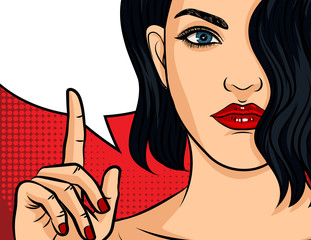 Wall Mural - Color vector pop art comic style illustration. Girl with red lipstick on red dotted background. Beautiful young woman points finger up. Girl making hand gesture. Brunette girl with wavy hair