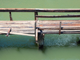 Wooden Bridge over Green Water Aerial Perspective