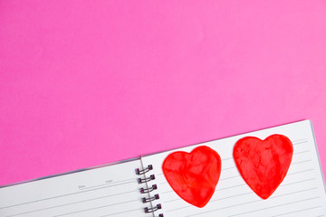 Big 2 hearts in blank book on pink background with space for text, Love icon, valentine's day, relationships concept