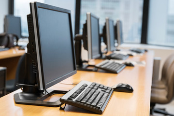 Empty computer room neatly placed for student.