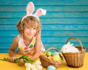 Wall Mural - Child playing with Easter bunny