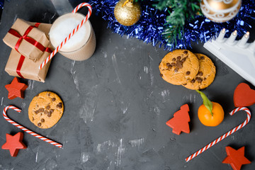 Wall Mural - Flat lay composition with Christmas cookies, decor  and cocoa on the black table