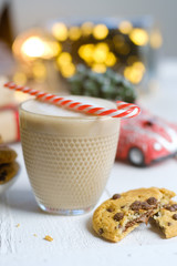 Wall Mural - Christmas cookies with chocolate and cocoa on the background of candles.