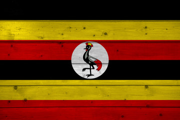 Flag of Uganda on wooden background, surface. Wooden wall, planks. National flag