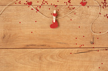 Valentine's Day Concept. Heart Shape Garland. Red Glitter Heart Hanging On Rope On Wooden Background