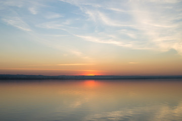  Beautiful red sunset over lake. Composition of nature.