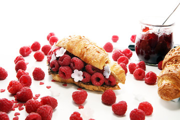 Wall Mural - Delicious breakfast with fresh croissants and ripe berries