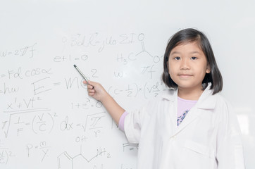 Wall Mural - little asian scientist girl pointing on white board