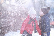 © alexkich - Kids walk in the park first snow