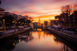 © Giulio - View of the Christmas Tree on a bridge at sunset, with orange clouds. Long exposure picture in Riccione, Emilia Romagna, Italy.