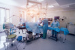 © romaset - Process of trauma surgery operation. Group of surgeons in operating room with surgery equipment.