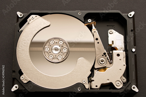 Fotografía Disassembled hard drive . Isolated on black background.