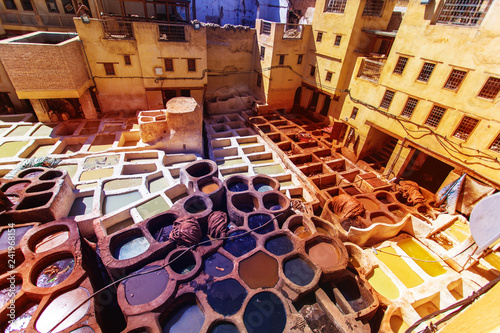 Fotomural Tanneries of Fes Morocco, Africa Old tanks of the Fez's tanneries with color pai