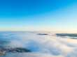 Aerial view clouds over forest during winter colours. Aerial view of forest and clouds. Aerial drone view of the forest. Aerial top view cloudscape. Texture of clouds.