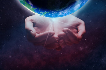 Leinwandbilder - Protect our world in human hands and nebula dust. Mixed media .Elements of this image furnished by NASA.