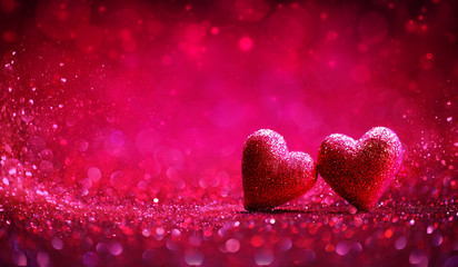 Wall Mural - two red hearts in shiny background - valentine's day