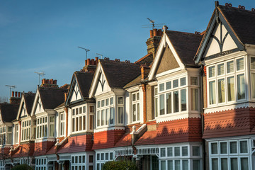 Wall Mural - Row of typical British homes against a clear blue sky