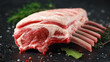 © grinchh - raw fresh rack of lamb with green herbs.