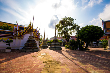 Pagoda buddha temple at Wat pho one of attraction sightseeing in morning with blue sky cloud