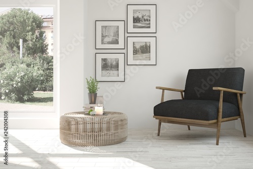 Fotografía Idea of white room with armchair and summer landscape in window