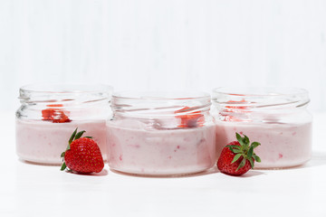 Wall Mural - strawberry yogurt, fresh berries on white table