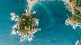 Fototapeta  - Aerial view of charming coastal Mediterranean small town on Sicily island, Taormina. Beaches of Taormina and south Italy.Travel destination, vacation in Italy concept.Aerial landscape of Bella Isola