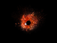 Conceptual Creative Photo Of A Female Eye Close-up In The Form Of Splashes, Explosion And Dripping Paint Isolated On A Black Background. Female Eye Close-up With Spray Paint Around.