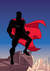 Poster - Silhouette of a superhero watching over the city from the roof of a tall building.