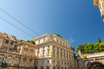 Palazzo Lercari-Parodi palace classic typical buildings on Piazza del Portello square and tunnel in historical centre of old european city Genoa (Genova) with blue clear sky background, Liguria, Italy