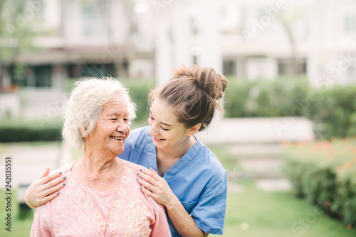 Fotografía Caregiver with Asian elderly woman outdoor
