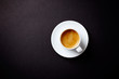 © Eugeniusz Dudziński - Cup of coffee on black background. Top view. Copy space.