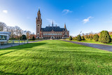 Fototapeta Nowy Jork - THE HAGUE, 4 December 2018 - Front view of the Peace Palace, seat of the International Court of Justice, view from the peaceful entrance with the green grass field
