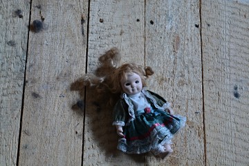 doll on a wooden background