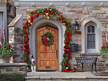 Wooden Front Door With Wreath And Festive Decorations