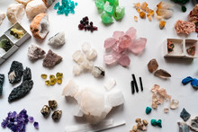 Collection Of Beautiful Precious Stones On White Table.