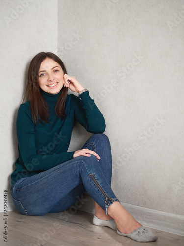 green sweater blue jeans