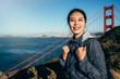 © PR Image Factory - girl backpacker standing on mountain hills
