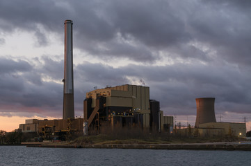 Power plant on Lake Michigan at sunrise.  Michigan City, Indiana, USA