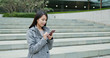 © leungchopan - Woman use of cellphone in Hong Kong city