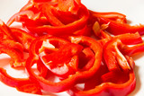 Fototapeta Kuchnia - Chopped red sweet pepper on white background