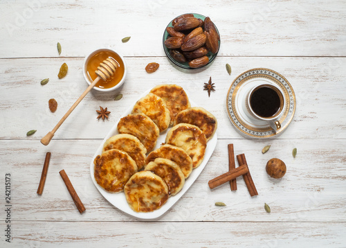 Fotografie, Obraz Arabic Sab Al Qafshah - cheese pancakes with honey and dates.