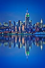 New York Skyline With Water Reflections  At Night
