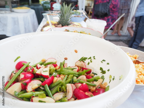 A Buffet Table With An Assortment Of Different Salads With Party