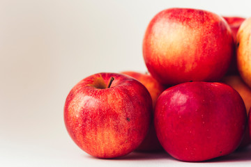 Fresh ripe red apples on white background, vegetarian concept.