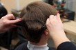 © ukrolenochka - Man having a haircut from hairdresser. Close-up picture of shaving a mans head