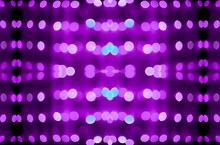 Abstract Symmetric Glitter Defocused Purple Lights Bokeh Texture On Black Background